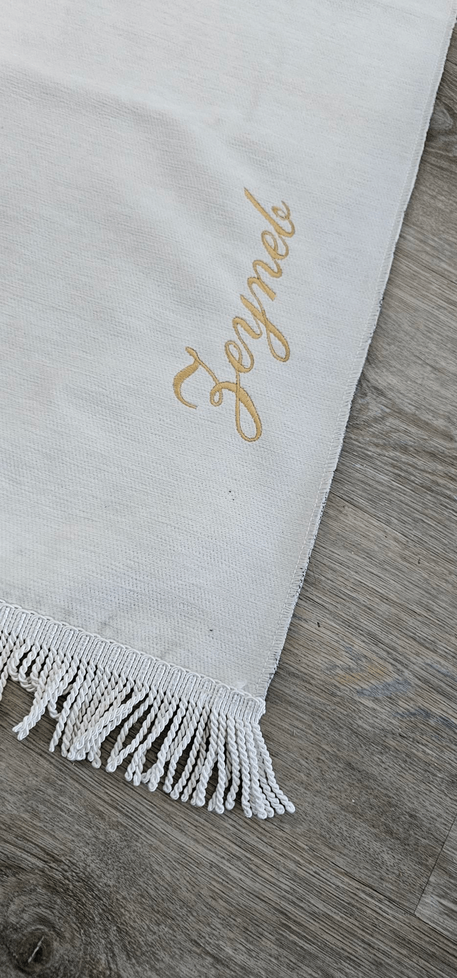 Tapis de prière brodé