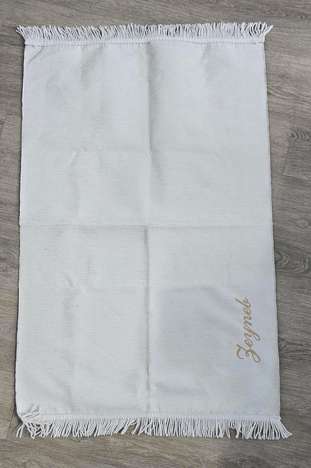 Tapis de prière brodé